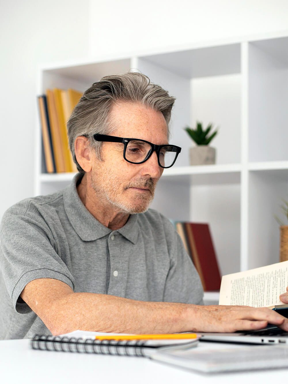 When I Am Gone Planner, Senior man at his desk looking at important books and documents